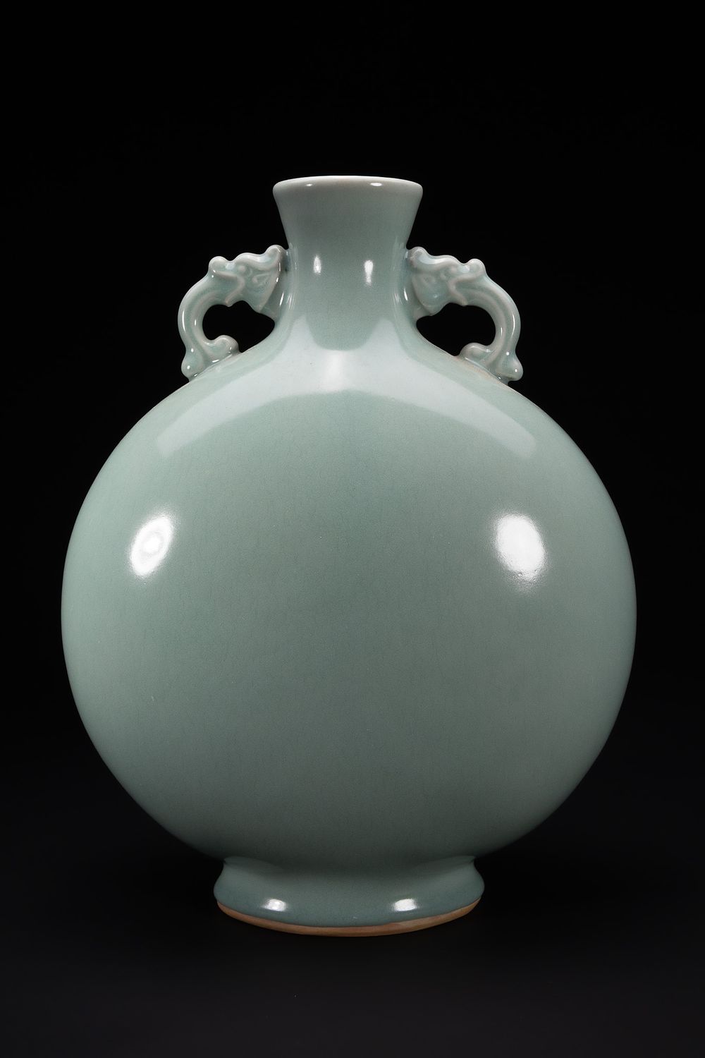 Lot 279: A Chinese Celadon-Glazed Double-Handled Moon Flask Vase.