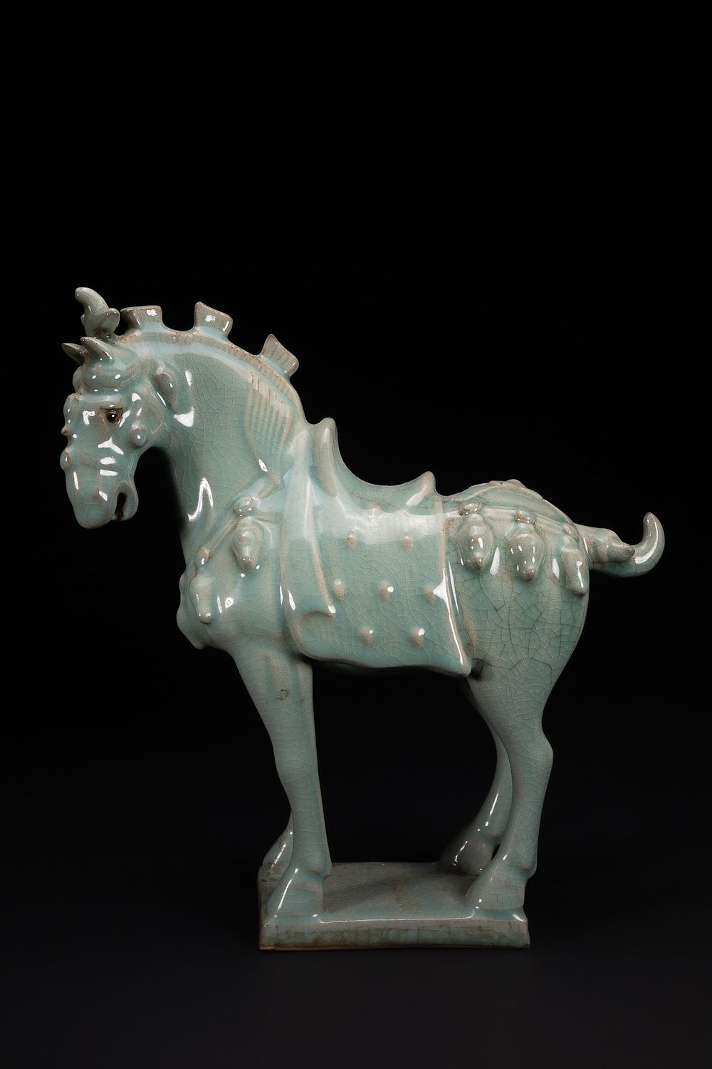 Lot 280: A Chinese Celadon-Glazed Model of a Horse.