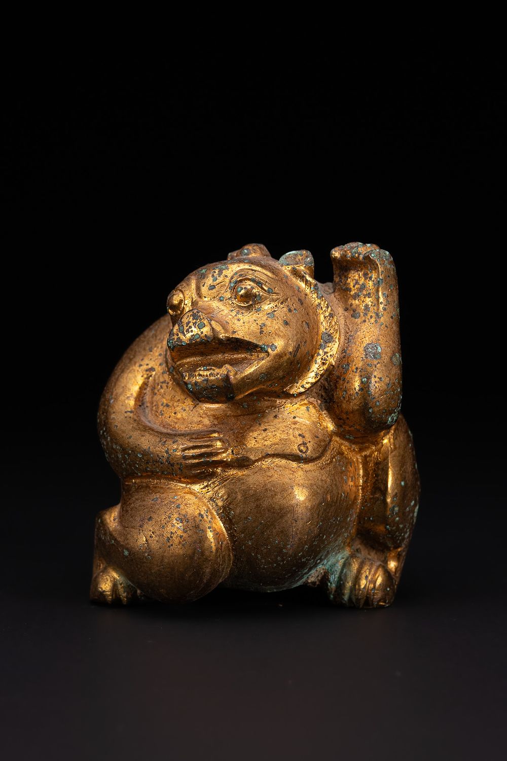 Lot 284: A Chinese Gilt-Bronze Figure of a Seated Mythical...