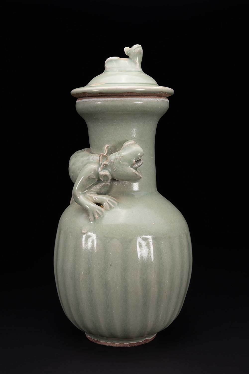 Lot 290: A Chinese Celadon-Glazed ‘Dragon’ Relief Lidded Vase.