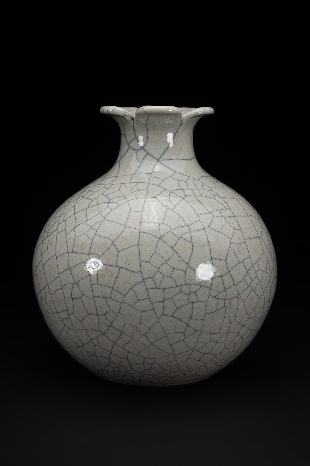 Lot 294: A Chinese Crackle-Glazed ‘Flower-Rim’ Vase, Six-Character Seal Mark.