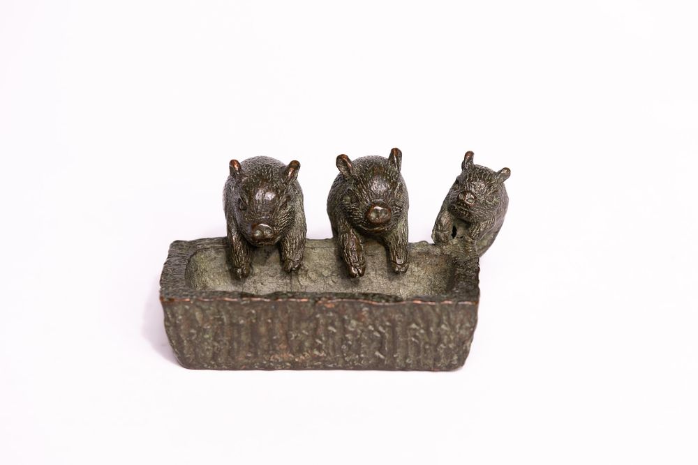 Lot 303: A Japanese Bronze Model of Three Boars in...