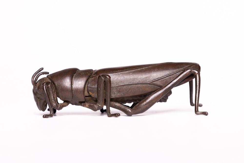 Lot 314: A Japanese Bronze Articulated Model of a Grasshopper.