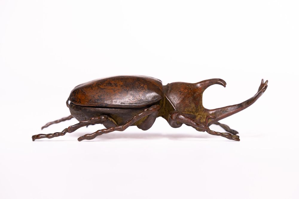 Lot 320: A Japanese Bronze Model of a Rhinoceros Beetle.