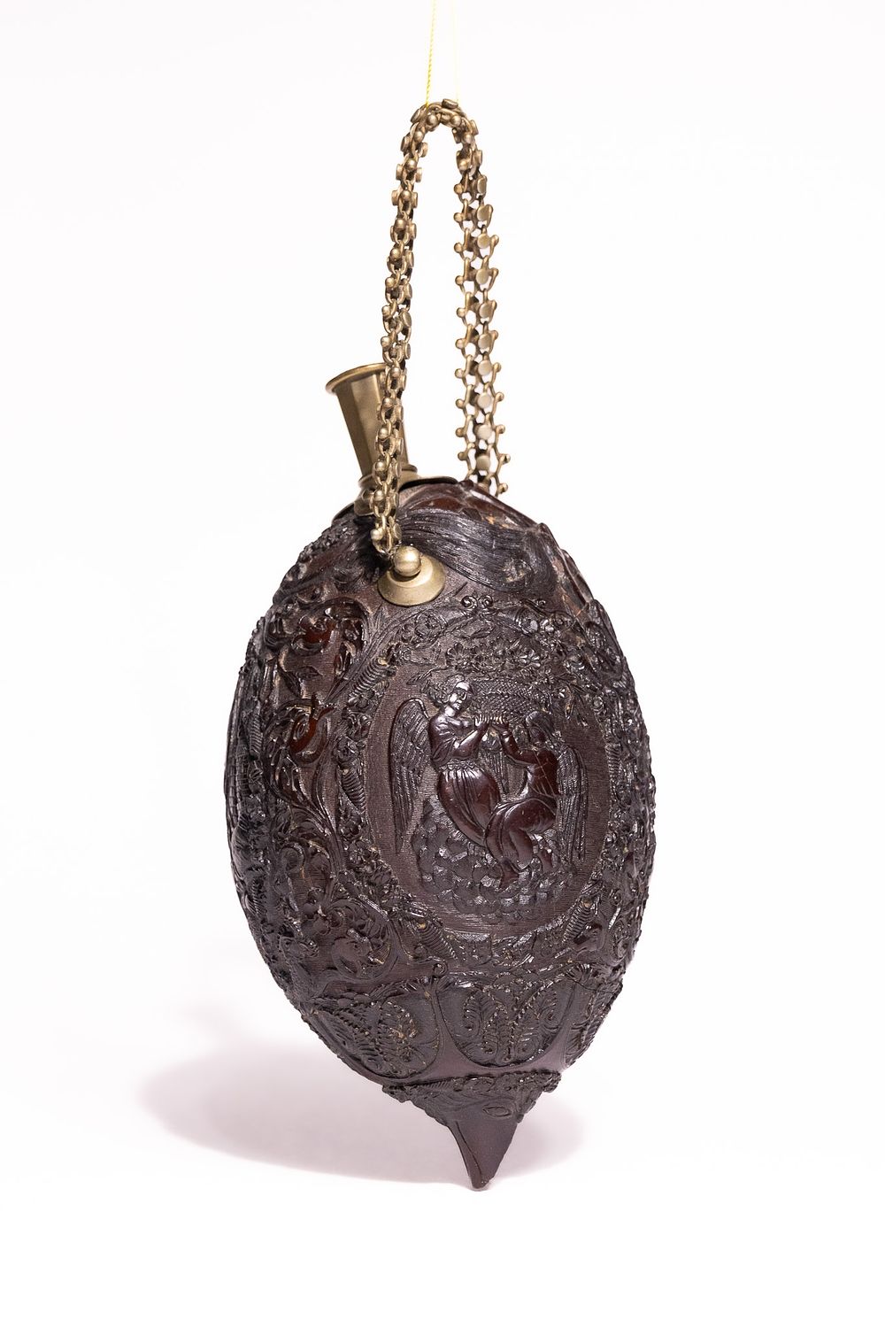 Lot 335: A Well-Carved Coconut ‘Bugbear’ Powder Flask, Probably Late...