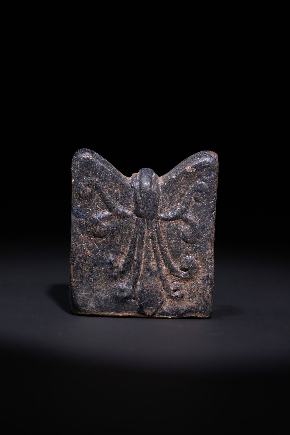 Lot 15: AN ISLAMIC CERAMIC CHESS PIECE, POSSIBLY 10TH–12TH CENTURY.