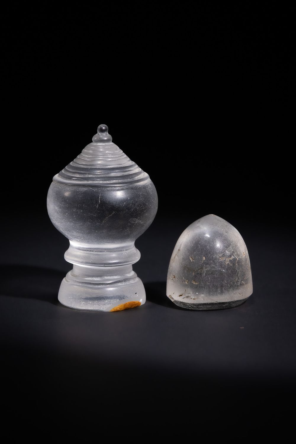 Lot 41: A MUGHAL ROCK CRYSTAL CHESS PAWN & AN ISLAMIC ROCK CRYSTAL CHESS PAWN.