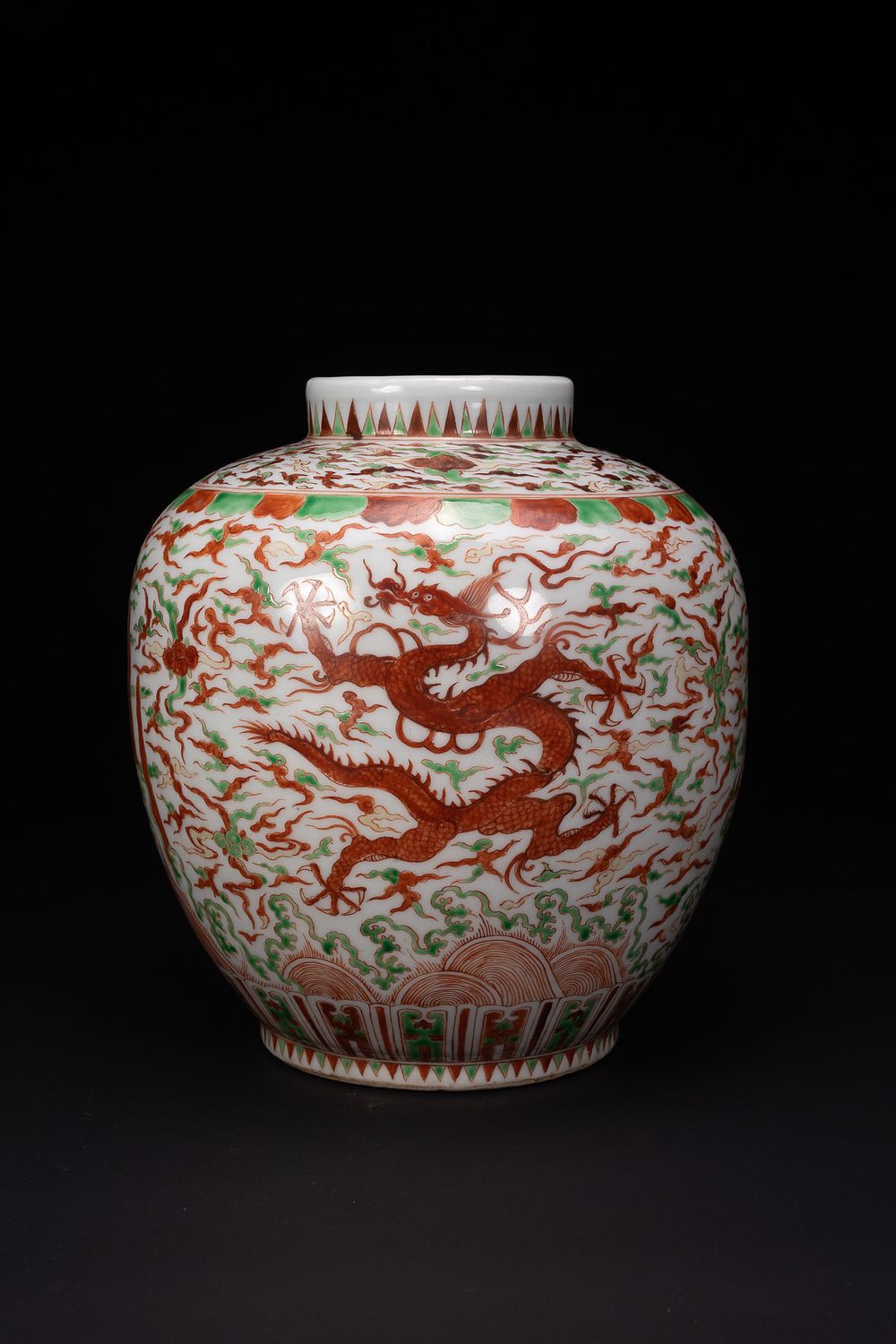 Lot 63: A CHINESE IRON-RED AND GREEN ENAMELLED DRAGON JAR.