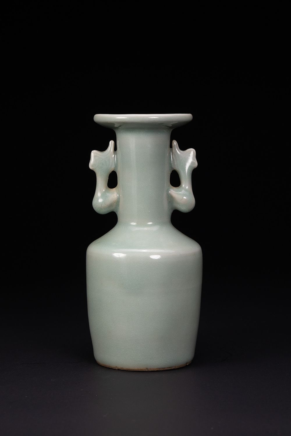 Lot 75: A CHINESE LONGQUAN CELADON-GLAZED PHOENIX-EAR MALLET VASE, MING DYNASTY.