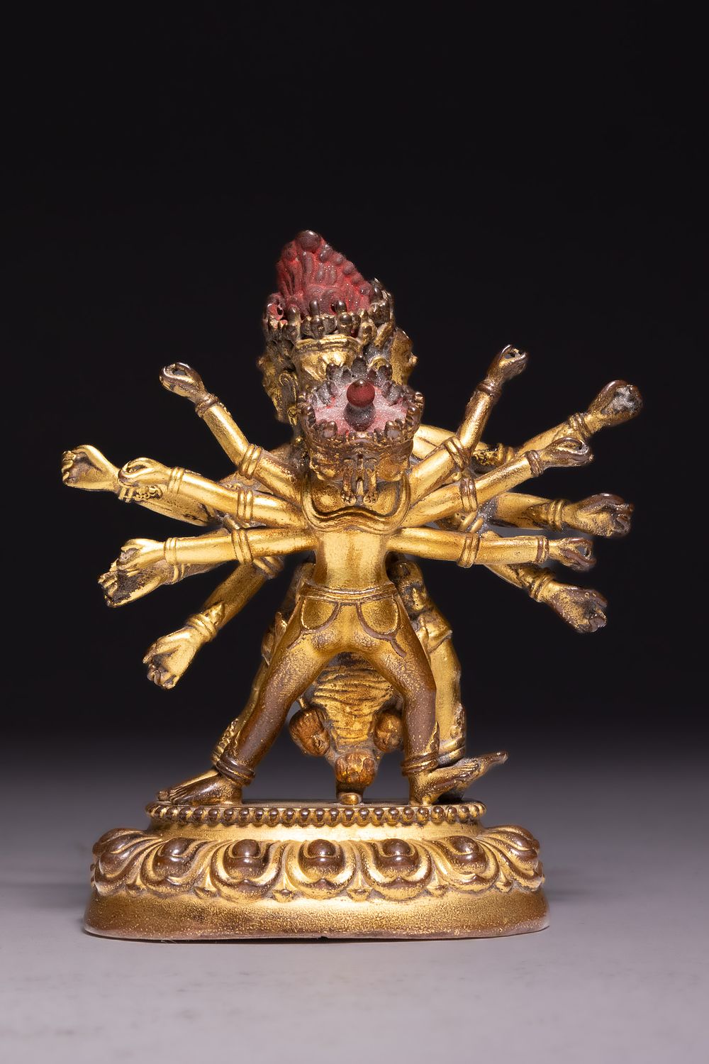 Lot 76: A TIBETAN GILT-BRONZE FIGURE OF HEVAJRA AND CONSORT, 18TH/19TH CENTURY.