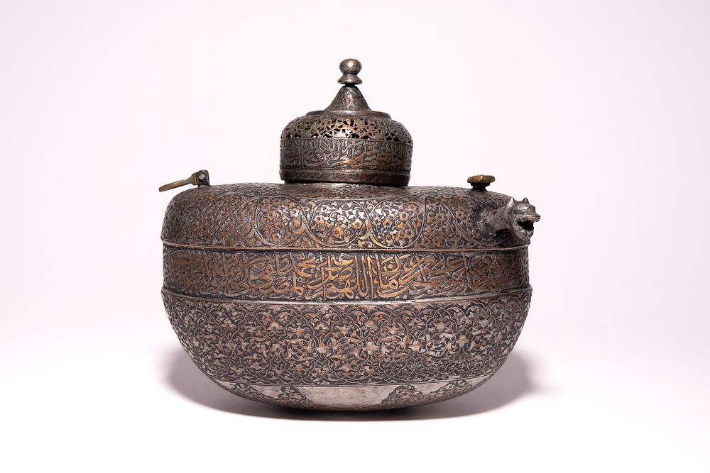 Lot 80: A PERSIAN COPPER KASHKUL, 18TH-19TH CENTURY.