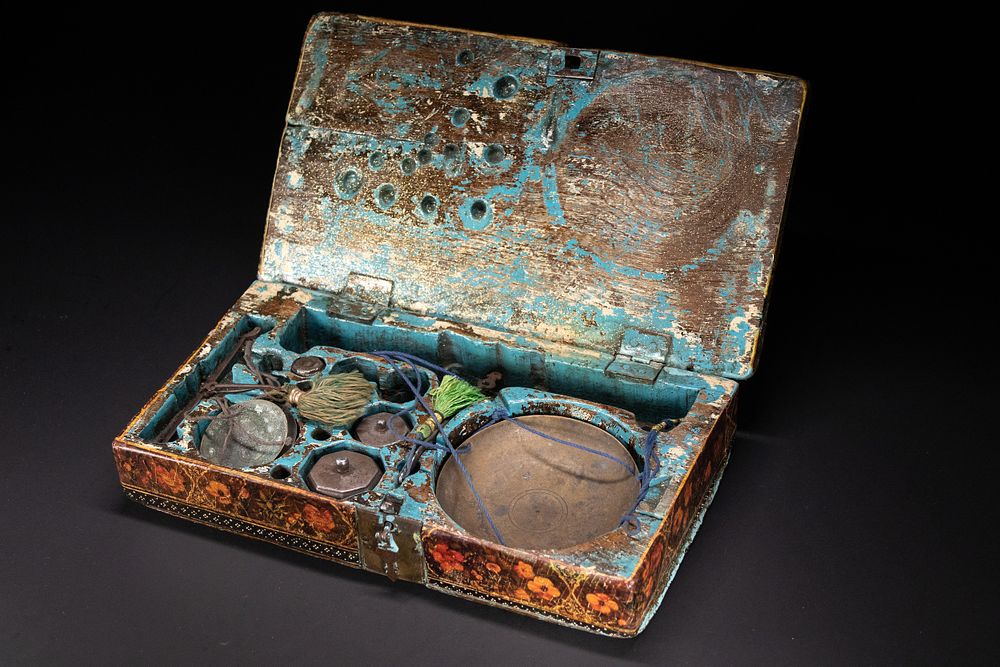 Lot 124: A QAJAR LACQUERED MERCHANT’S SCALE BOX, SIGNED BY HASHIM OF ISFAHAN, PERSIA, 19TH CENTURY.