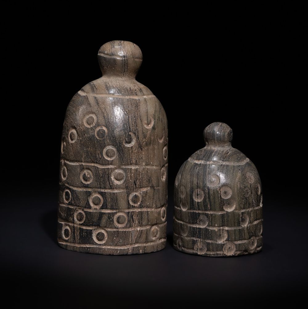 Lot 128: A PAIR OF ISLAMIC STONE CHESS PIECES, 20TH CENTURY.