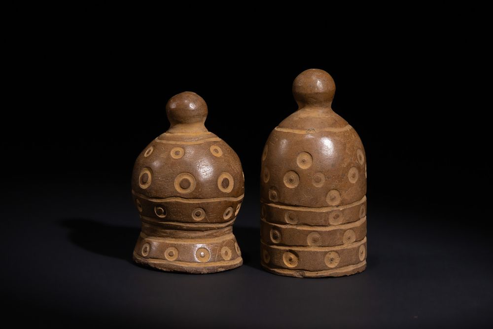 Lot 144: A PAIR OF ISLAMIC POTTERY CHESS PIECES, 20TH CENTURY.