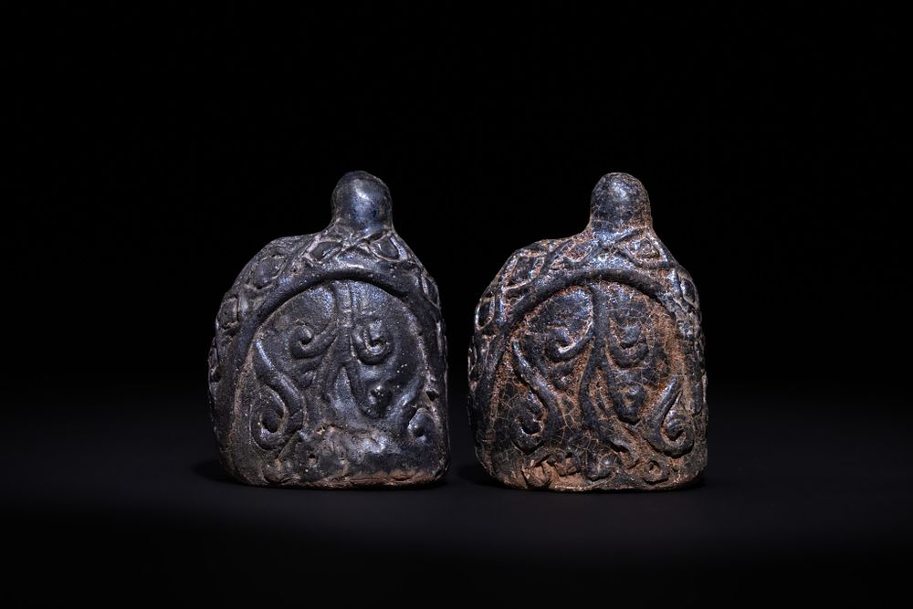 Lot 172: A PAIR OF ISLAMIC GLAZED CERAMIC CHESS PAWNS, 19TH CENTURY.