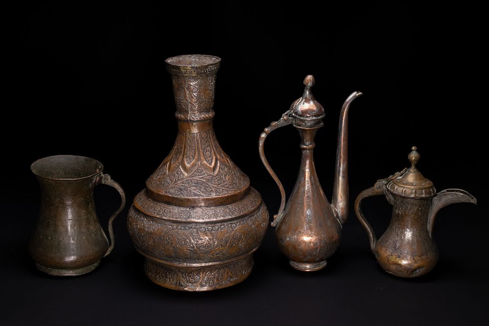 Lot 177: **NO RESERVE** A COLLECTION OF OTTOMAN OR PERSIAN STYLE CHASED AND REPOUSSÉ COPPER METALWARE.