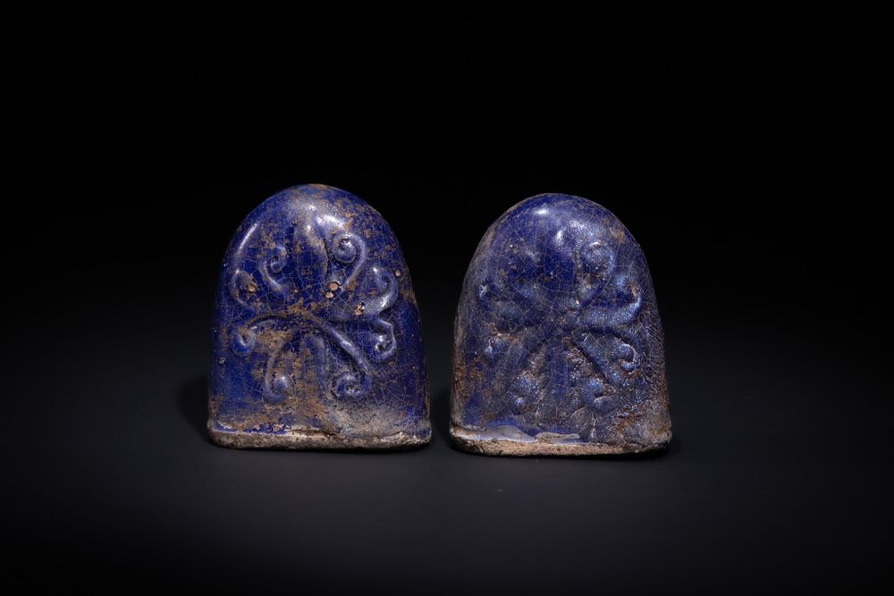 Lot 179: A PAIR OF ISLAMIC BLUE-GLAZED CERAMIC CHESS PAWNS, 19TH CENTURY.