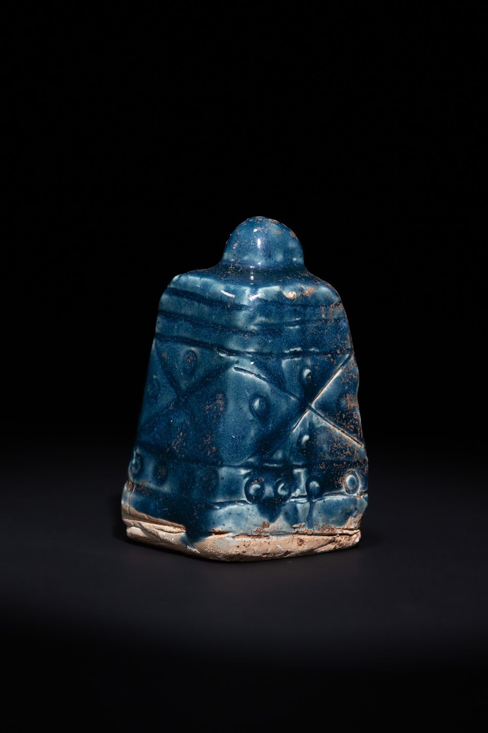 Lot 181: AN ISLAMIC BLUE GLAZED CERAMIC CHESS ROOK, 19TH CENTURY.