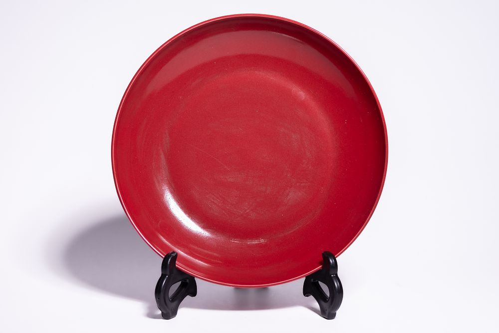 Lot 190: A CHINESE MONOCHROME COPPER-RED GLAZED PORCELAIN DISH, YONGZHENG MARK.