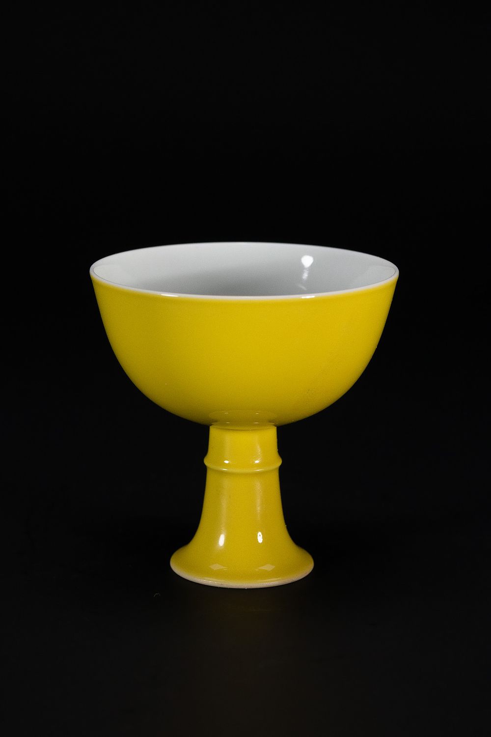 Lot 198: A CHINESE YELLOW-GLAZED PORCELAIN STEM CUP, YONGZHENG MARK.
