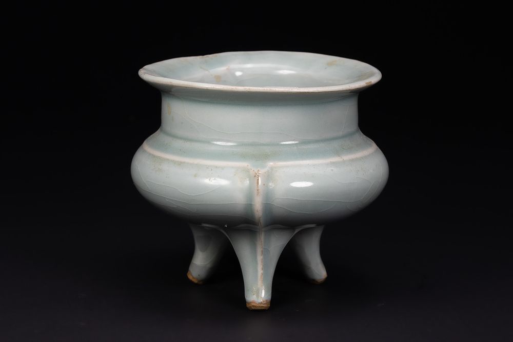 Lot 214: A CHINESE LONGQUAN CELADON-GLAZED TRIPOD CENSER, YUAN-EARLY MING CENTURY, 14TH CENTURY.