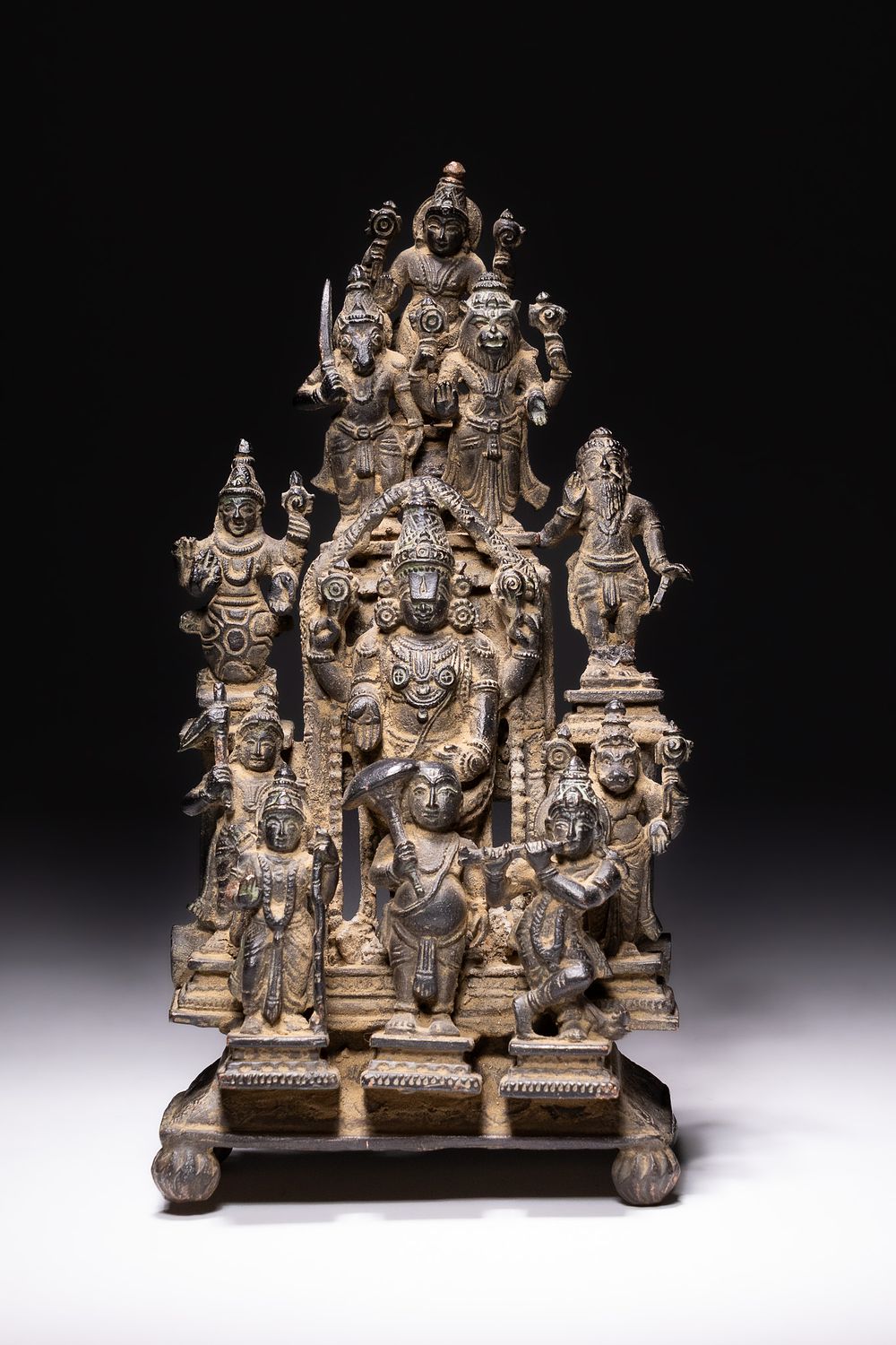 Lot 236: A SOUTH INDIAN COPPER ALLOY SHRINE OF VISHNU AND THE DASHAVATARA, 18TH-19TH CENTURY.
