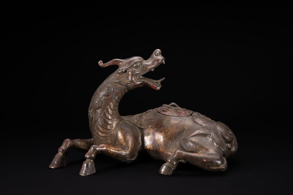 Lot 251: A CHINESE GILT BRONZE QILIN CENSER.