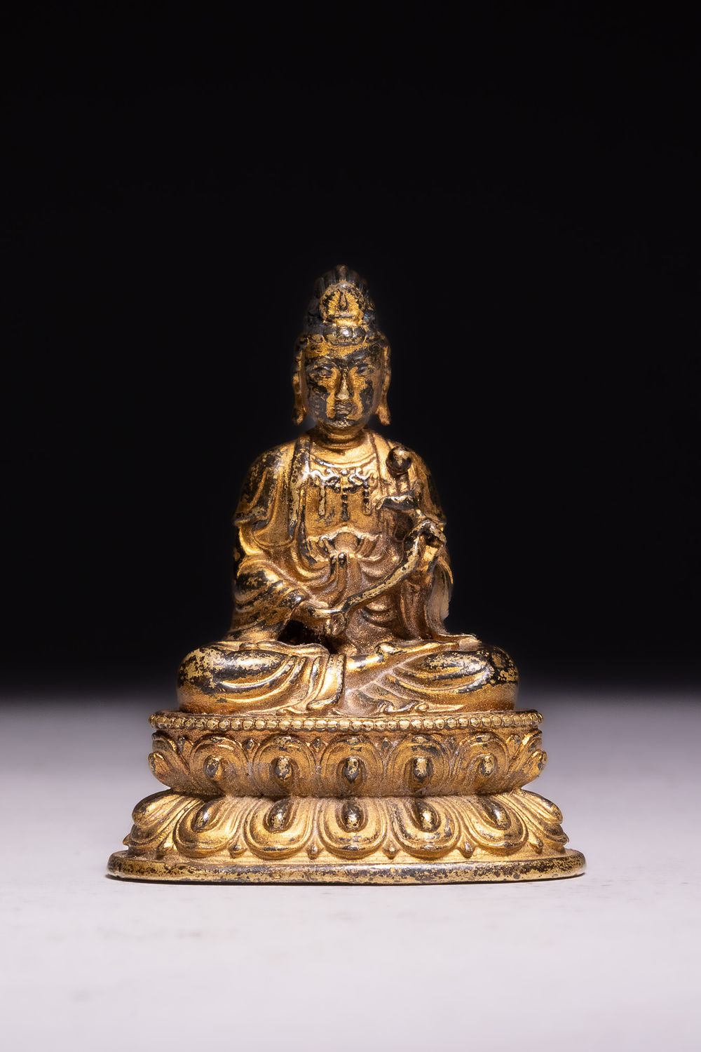 Lot 304: A SINO-TIBETAN GILT BRONZE FIGURE OF GUANYIN, 19TH CENTURY.