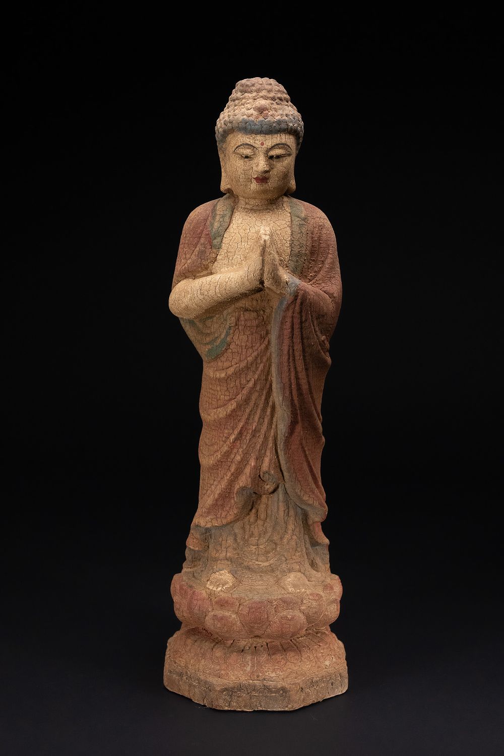 Lot 339: AN EAST ASIAN POLYCHROME DECORATED CARVED WOOD FIGURE OF A STANDING BUDDHA.