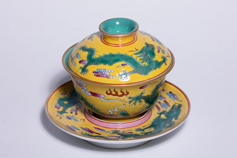 Lot 347: A CHINESE FAMILLE JAUNE DRAGON TEA BOWL AND SAUCER.