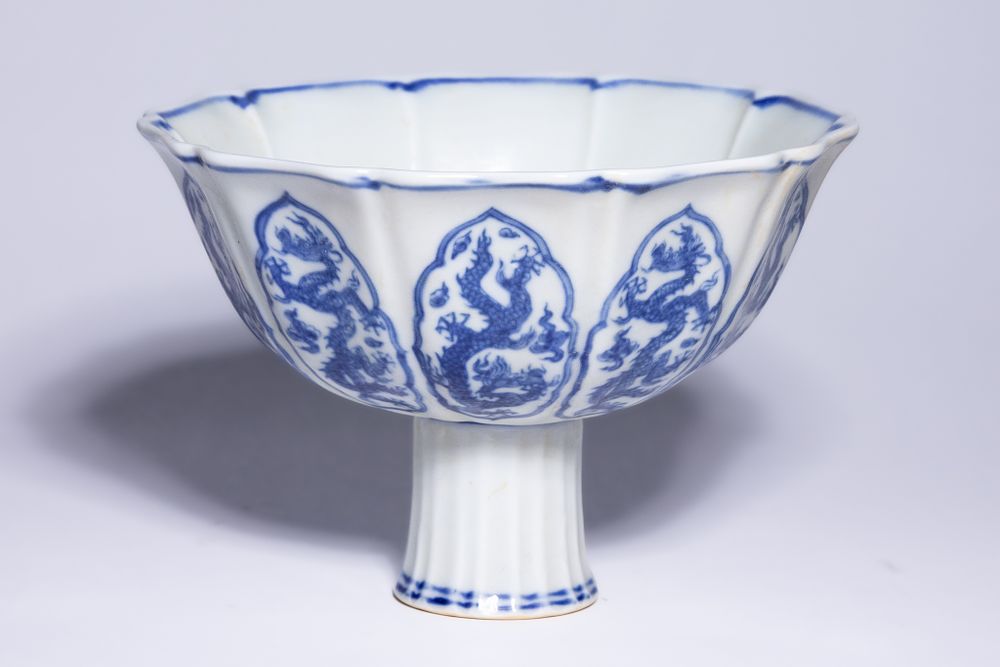 Lot 350: A CHINESE BLUE AND WHITE PORCELAIN DRAGON STEM CUP, XUANDE MARK.