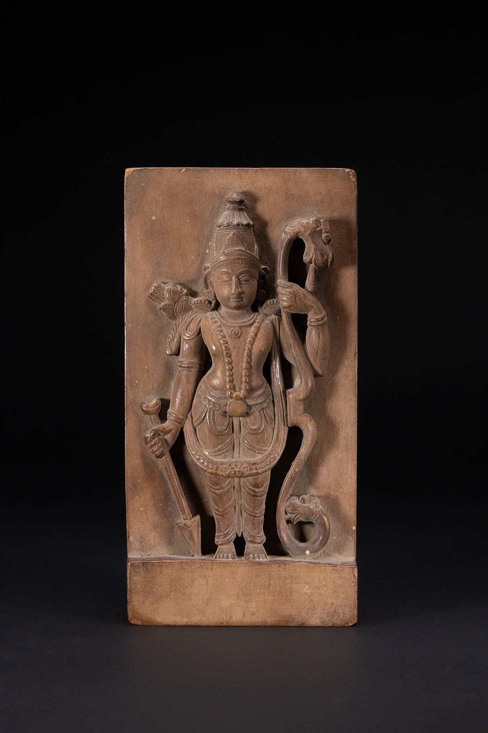 Lot 364: A SOUTHERN INDIAN CARVED HARDWOOD RELIEF PLAQUE OF LORD RAMA, LATE 19TH OR EARLY 20TH CENTURY.