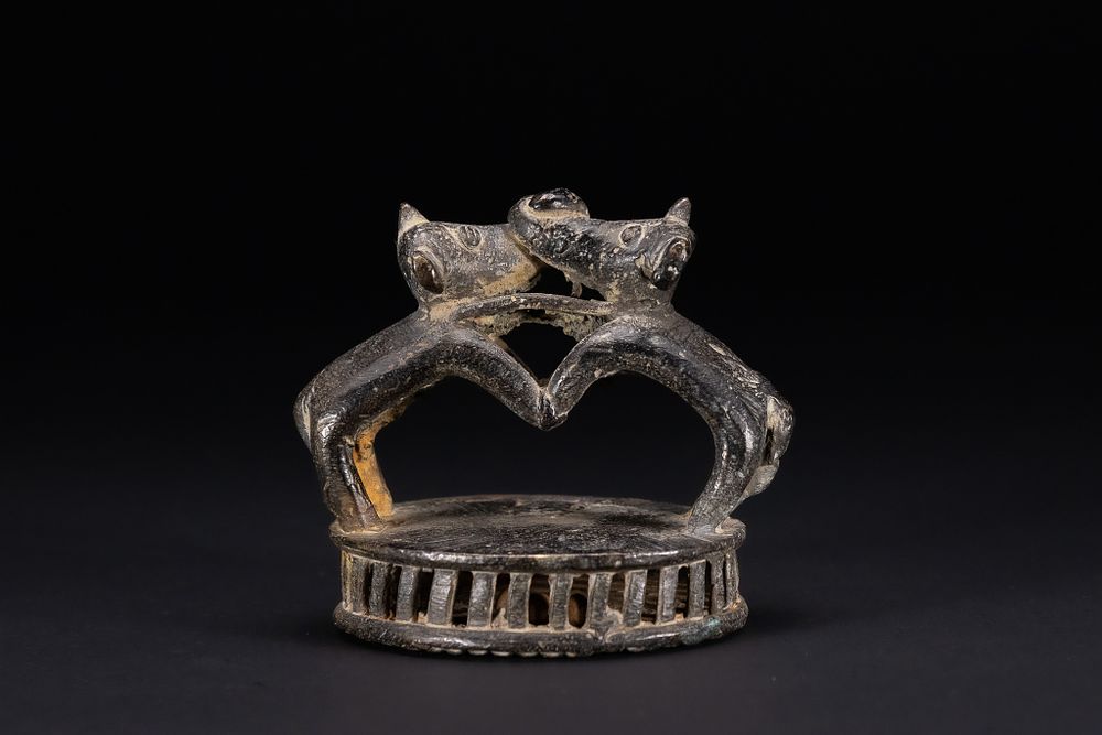 Lot 373: AN INDIAN BRONZE FOOT SCRAPER WITH ANIMAL FIGURES, 19TH/20TH CENTURY.