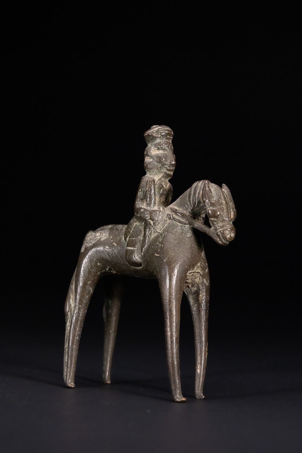 Lot 385: AN INDIAN CAST BRONZE EQUESTRIAN FIGURE, 20TH CENTURY.