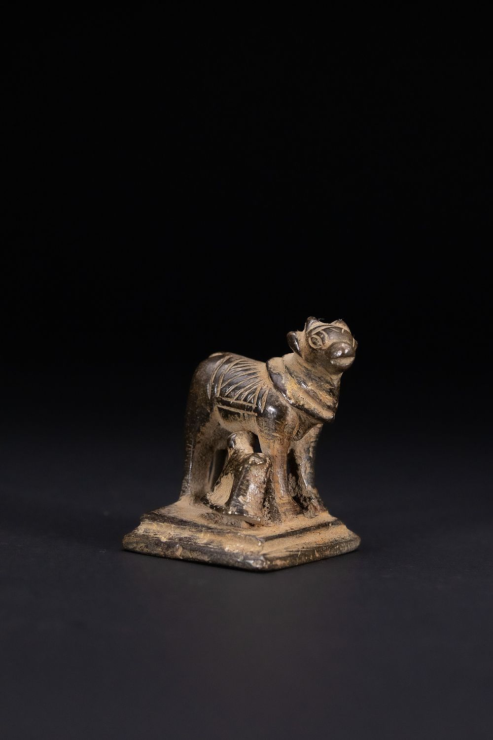 Lot 393: AN INDIAN CAST BRONZE RITUAL FIGURE OF KAMADHENU AND CALF, 19TH CENTURY.