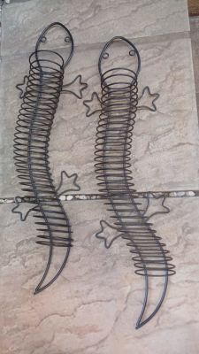 A Pair of Metal CD/DVD Holding Lizards. Can be on a shelf or mounted on a wall. Cute looking and 