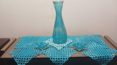 Turquoise Table Decorations. . Included: 
Tall glass carafe shaped vase 
Glass bird candle 