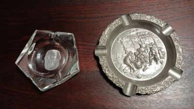 Ashtrays 2. . 1 Dutch Pressed Silver Metal Ashtray the other glass depicting a pharaoh's head. 