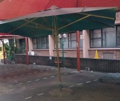 Large Outdoor Canvas Umbrella Concrete Base & Cover. A BIG used umbrella with a large heavy 