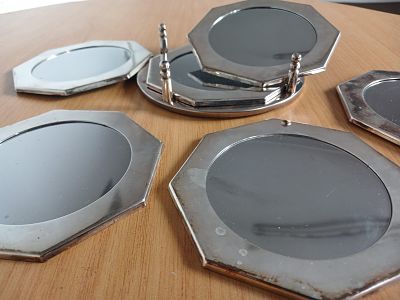Luxurious 7-Piece Coaster Set in Silver Plate & Mirror . Each coaster features exquisite silver 
