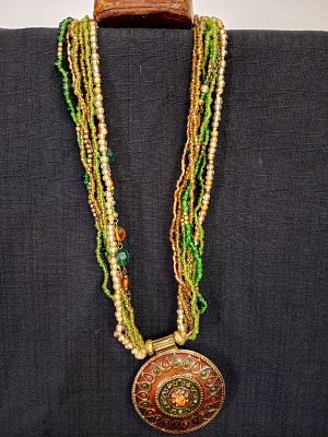 Multi-strand Beaded Necklace. Multi-strand beaded necklace in earthy tones of green, gold and 