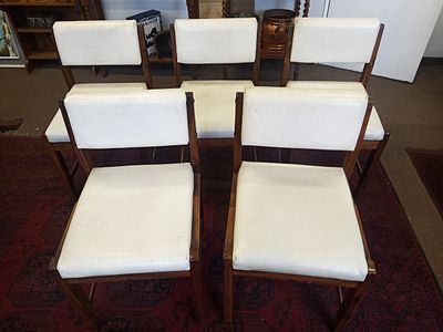 Mid-Century Chairs. . The 5 solid wood dining chairs have a minimalistic brutalist design 
