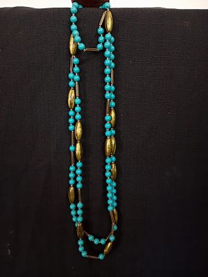 Layered Necklace. Vintage-style necklace featuring two strands of round turquoise beads combined 