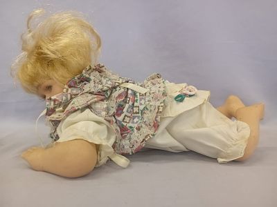 Crawling Baby Doll. This is a charming crawling baby doll with delicate porcelain hands, feet 