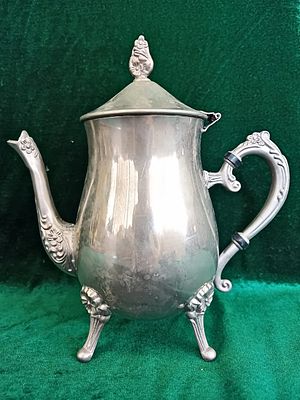 Silver-Plated Coffee Pot. This elegant silver-plated coffee/tea pot stands 23 cm tall and 