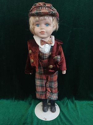Porcelain Doll Scottish Boy. The porcelain doll depicts a young Scottish boy, standing at 43 cm 
