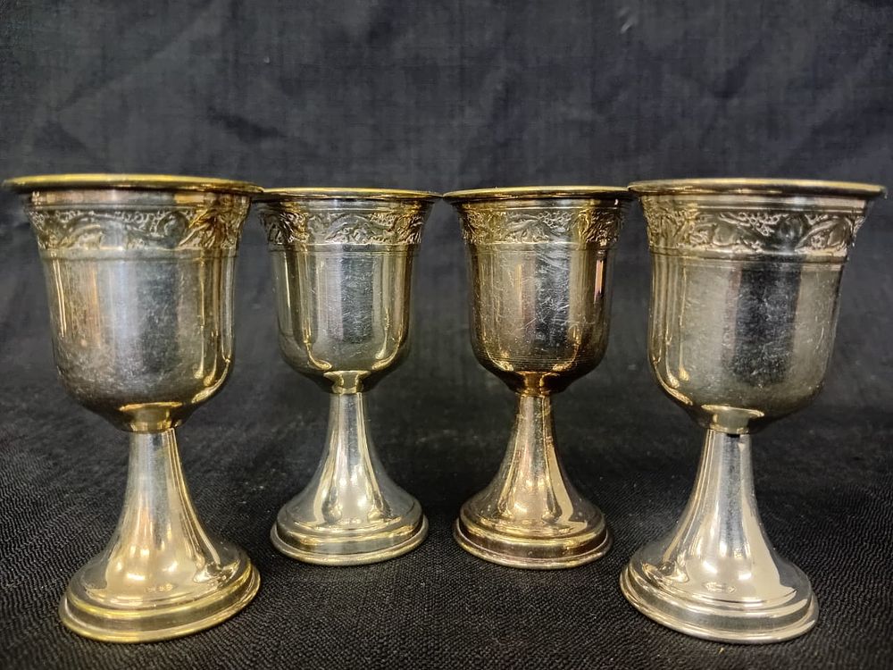 Set of Four Silver Plated Kiddush Cups. A set of four silver-plated Kiddush cups, each elegantly 