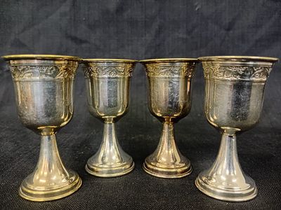 Set of Four Silver Plated Kiddush Cups. A set of four silver-plated Kiddush cups, each elegantly 
