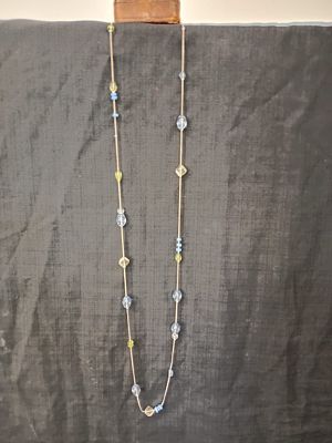 Beaded Necklace . This necklace measures approximately 60cm in length. Features spaced-out beads 