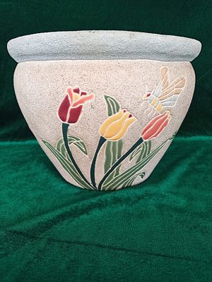 Flower Pot . This flower pot features a charming design with a bee and three tulips painted on 